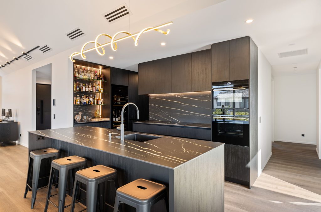 Hallmark Homes Christchurch Oakbridge design and build luxury kitchen featuring dark marble countertops, modern cabinetry, and integrated appliances in home