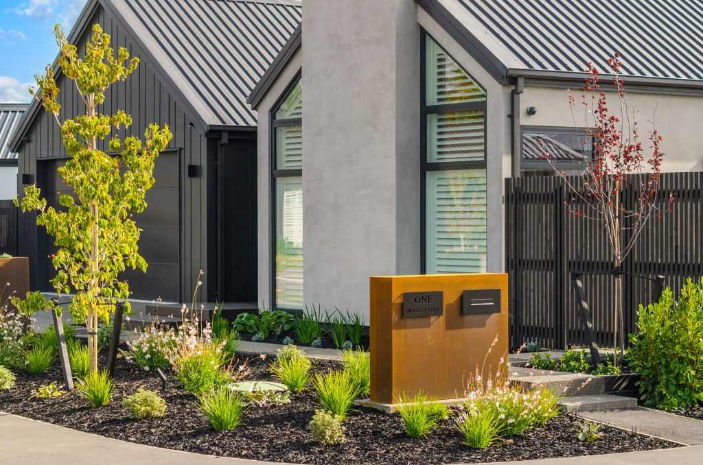 Striking front exterior of Hallmark Homes’ Oakbridge design in Christchurch, blending natural cedar and plaster for a warm, modern look that suits both urban and rural lifestyles.